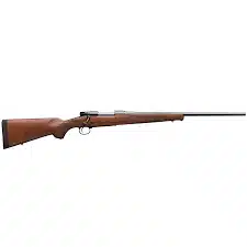Side-view bolt-action hunting rifle with wooden stock and blued barrel on white background