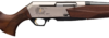 Side view of a sleek, modern shotgun with elegant wood stock and engraved design, showcasing craftsmanship and detail.