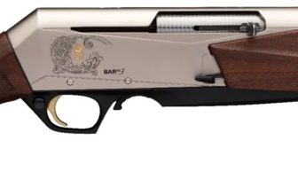 Side view of a sleek, modern shotgun with elegant wood stock and engraved design, showcasing craftsmanship and detail.