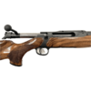 Close-up of a sleek, modern rifle showcasing detailed wood grain and precision engineering. Ideal for hunting enthusiasts.